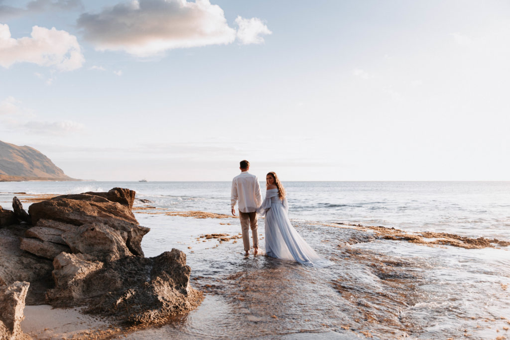 wedding couple walking on the beach at makua beach