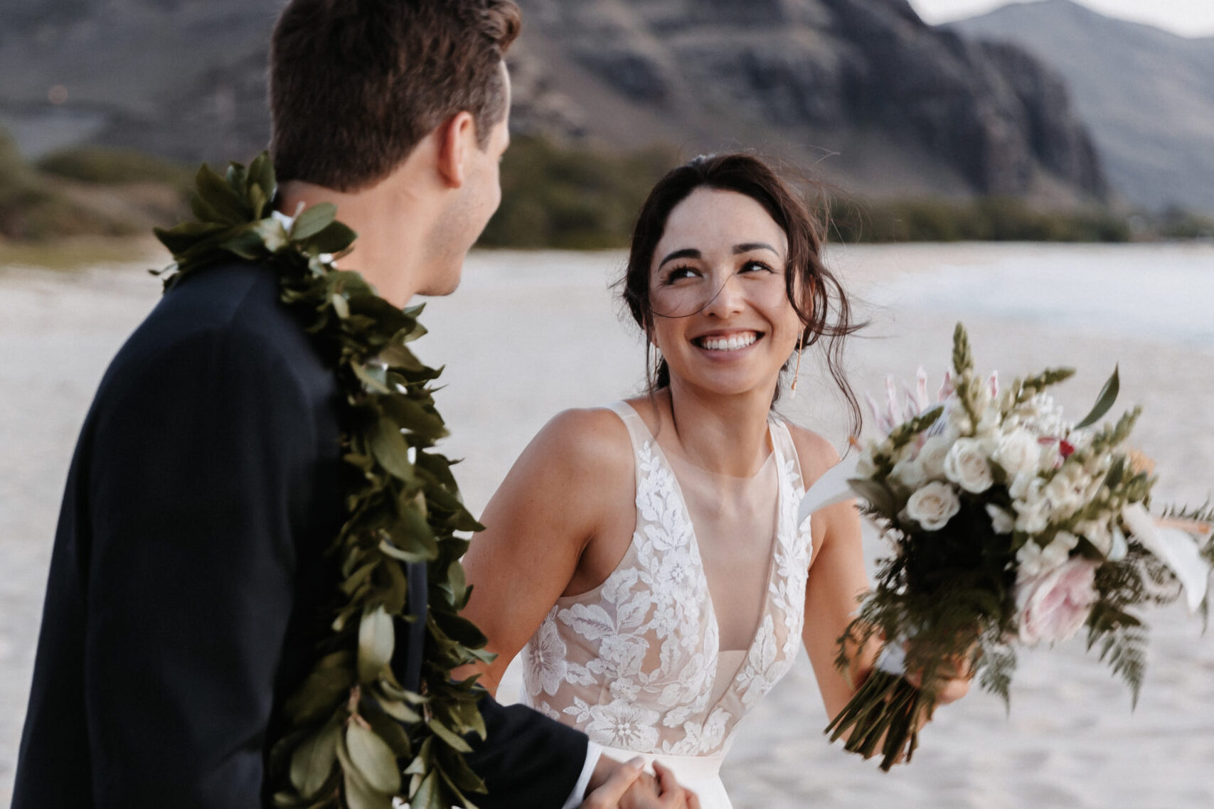 Couple enjoying the sands of hawaii at their elopement