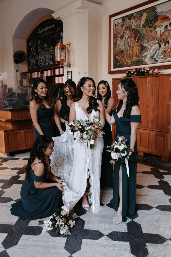 bride with bridesmaids in European architecture at royal hawaiian hotel