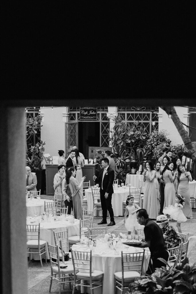 Wedding reception at cafe julia through architectural column in black and white