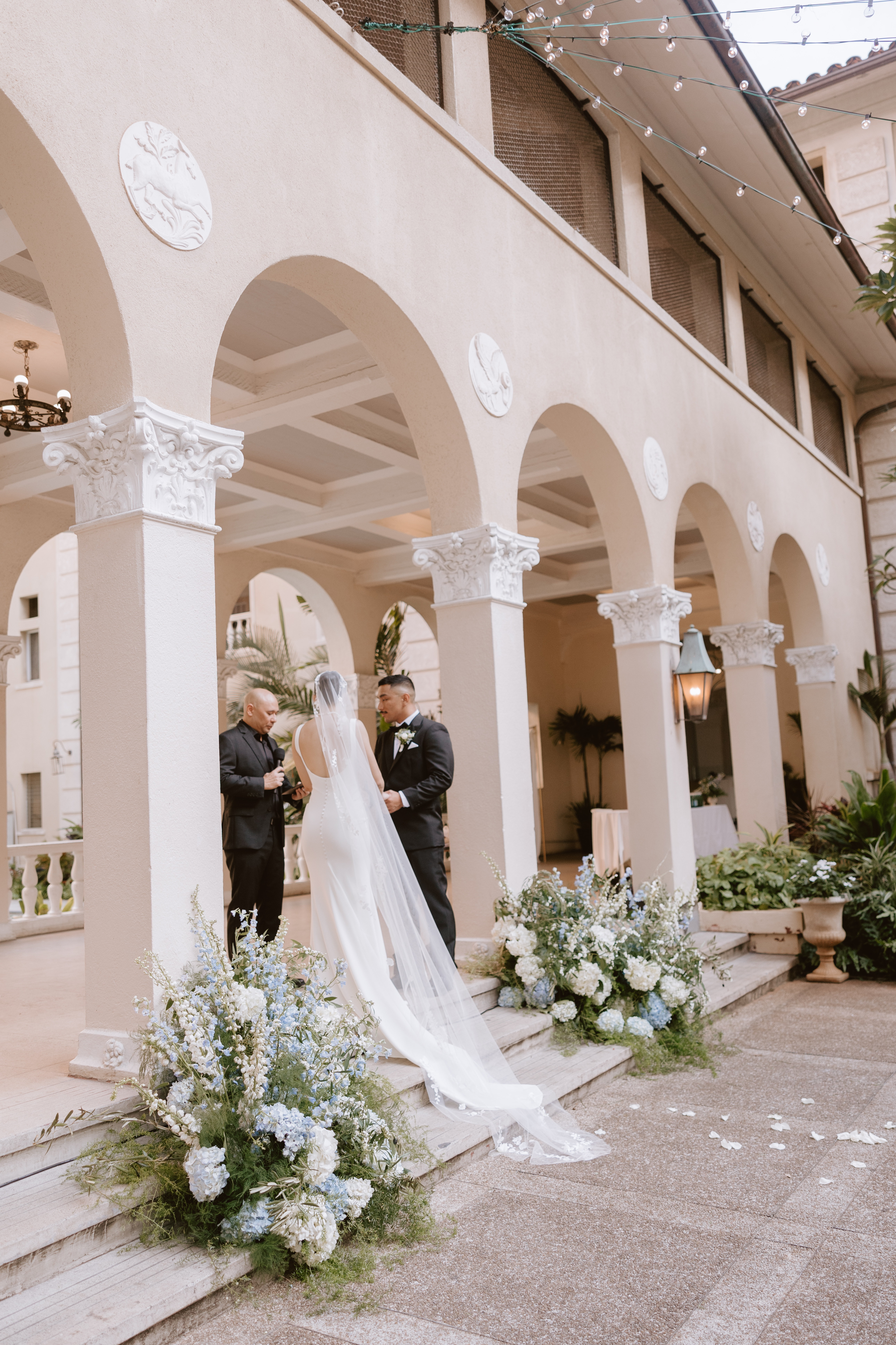 Romantic Cafe Julia wedding setup featuring historic architecture and tropical details in Honolulu.