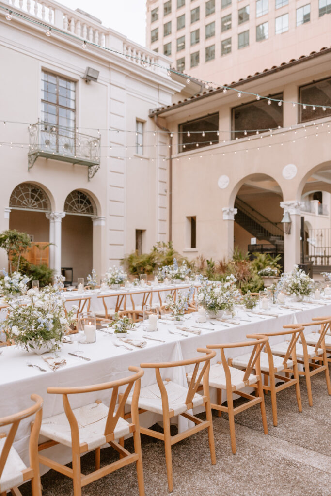 Wide shot of the Cafe Julia courtyard reception set up under the Hawaiian sky.