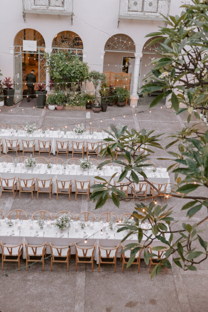 Overhead shot of the reception at Cafe Julia’s lanai, showcasing tropical decor and intimate lighting.