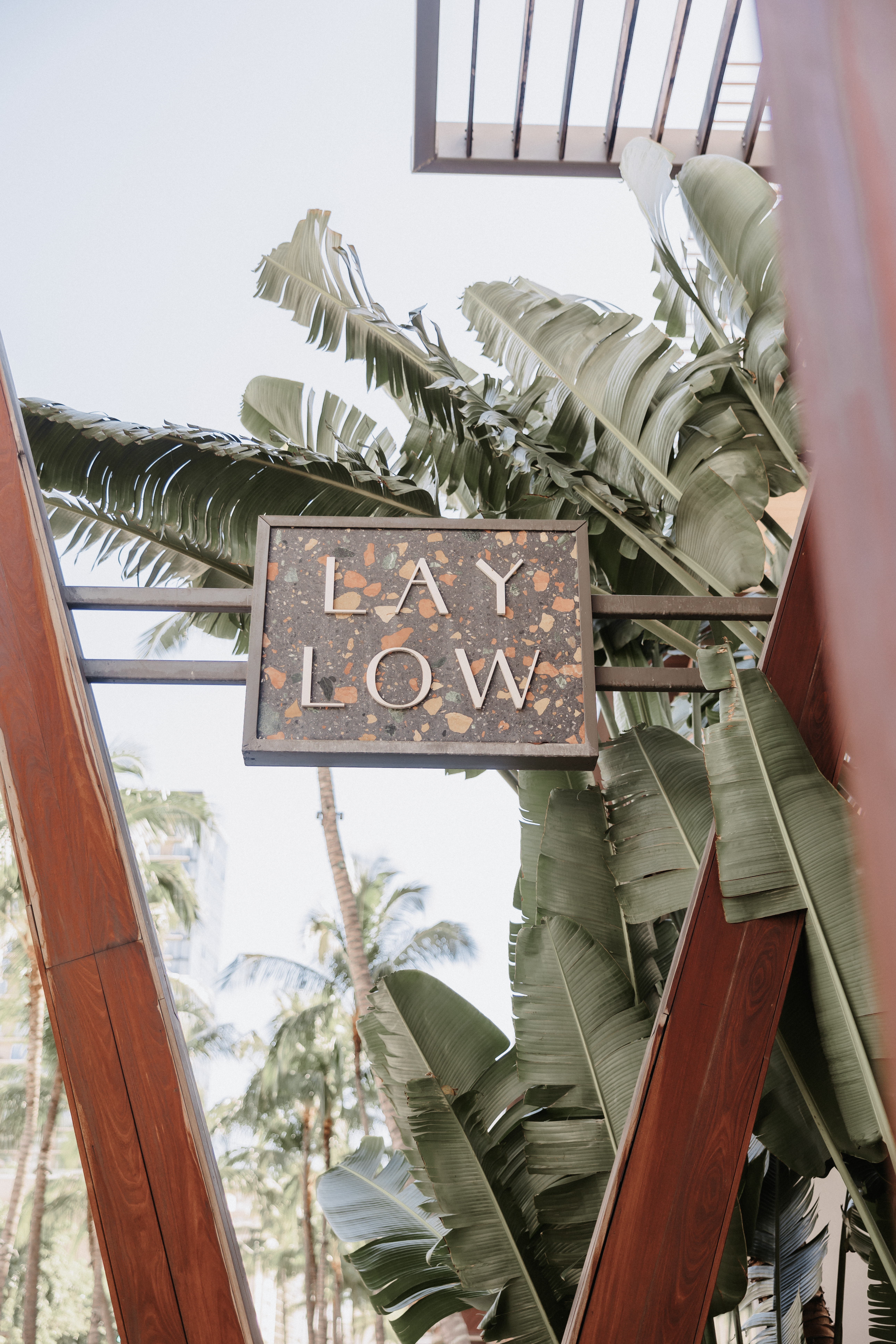 The laylow waikiki sign as guests arrive for multi-day wedding celebration