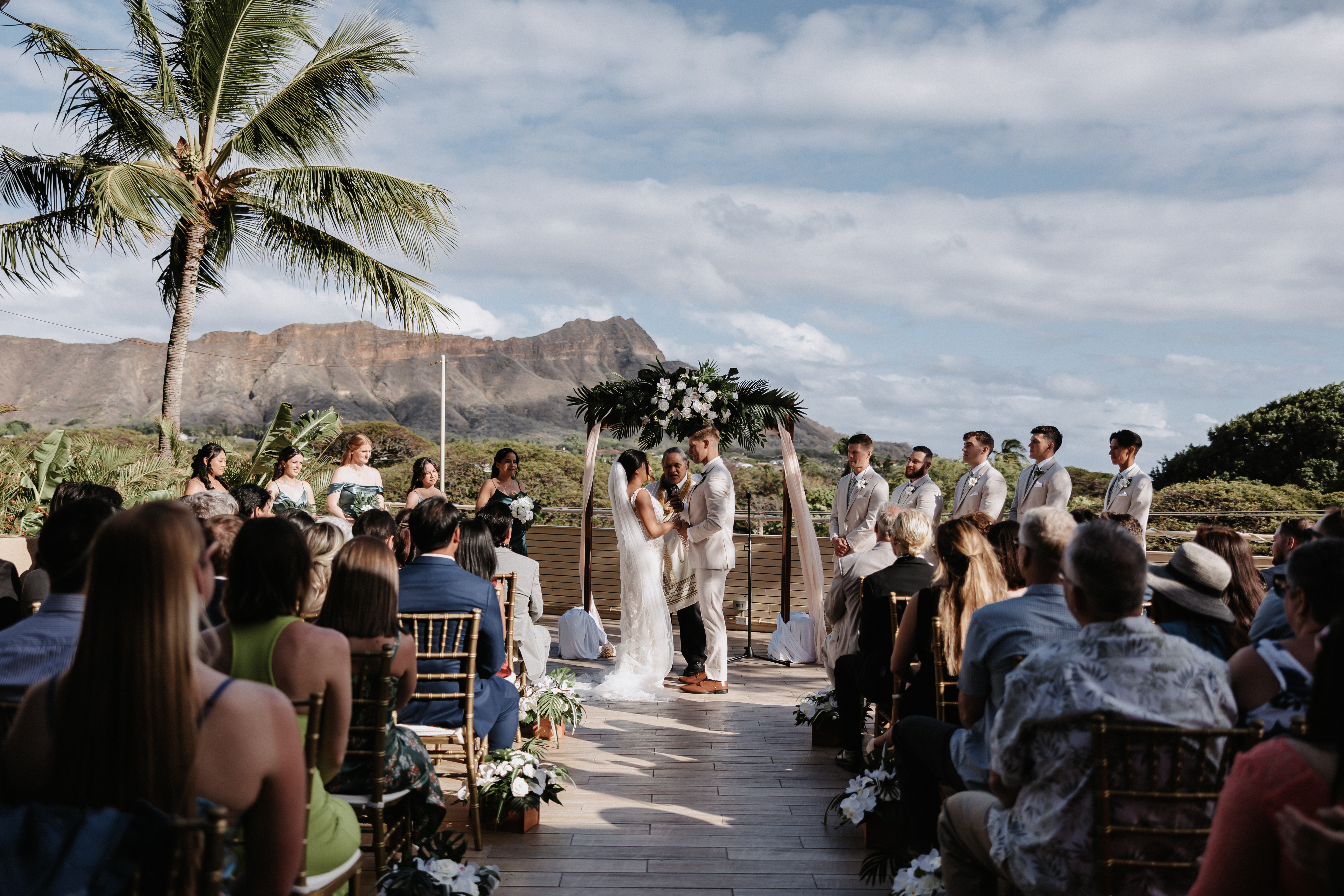 Couple married at ceremony in front of Diamond Head at The Deck Waikiki