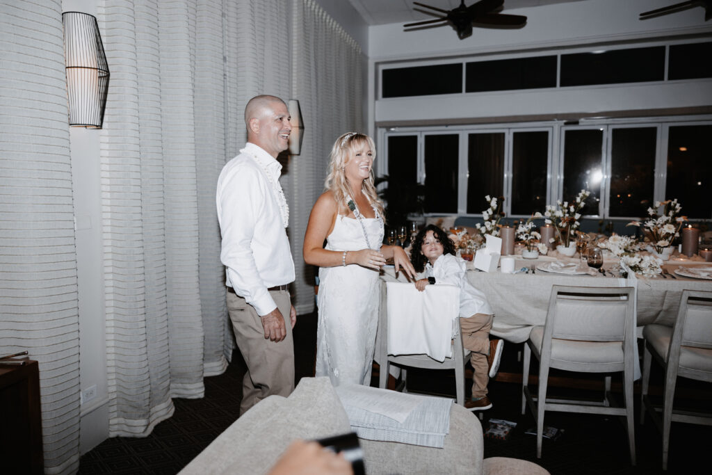 A couple enjoying a themed post-wedding dinner with friends.