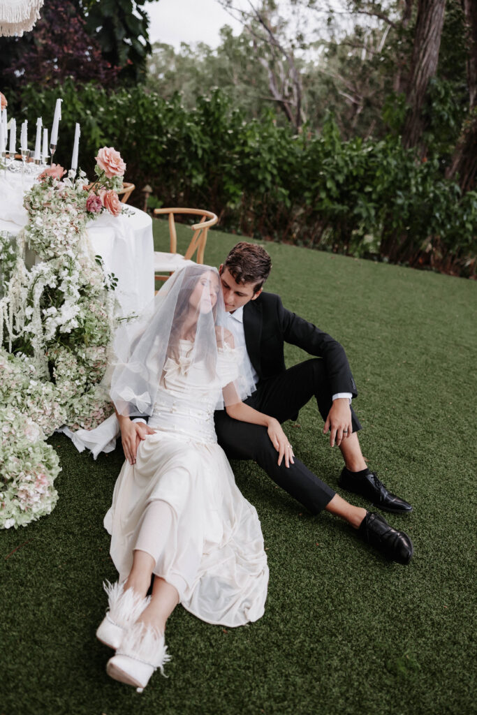 Intimate candid moment between the newlyweds at Sunset Ranch, showcasing the art of storytelling in fine art wedding photography.