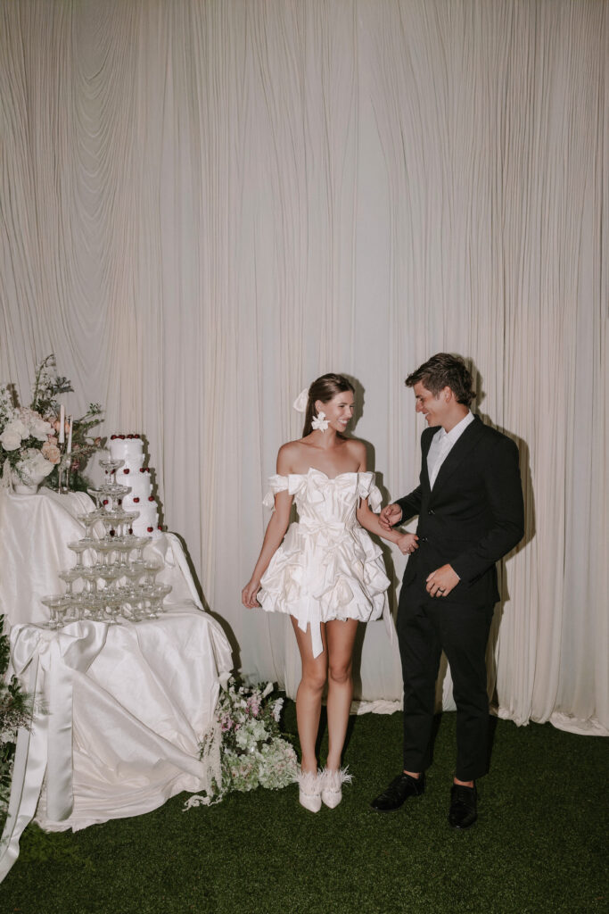 Bride and groom candid during their reception at Sunset Ranch Hawaii, evoking feeling through imperfections.