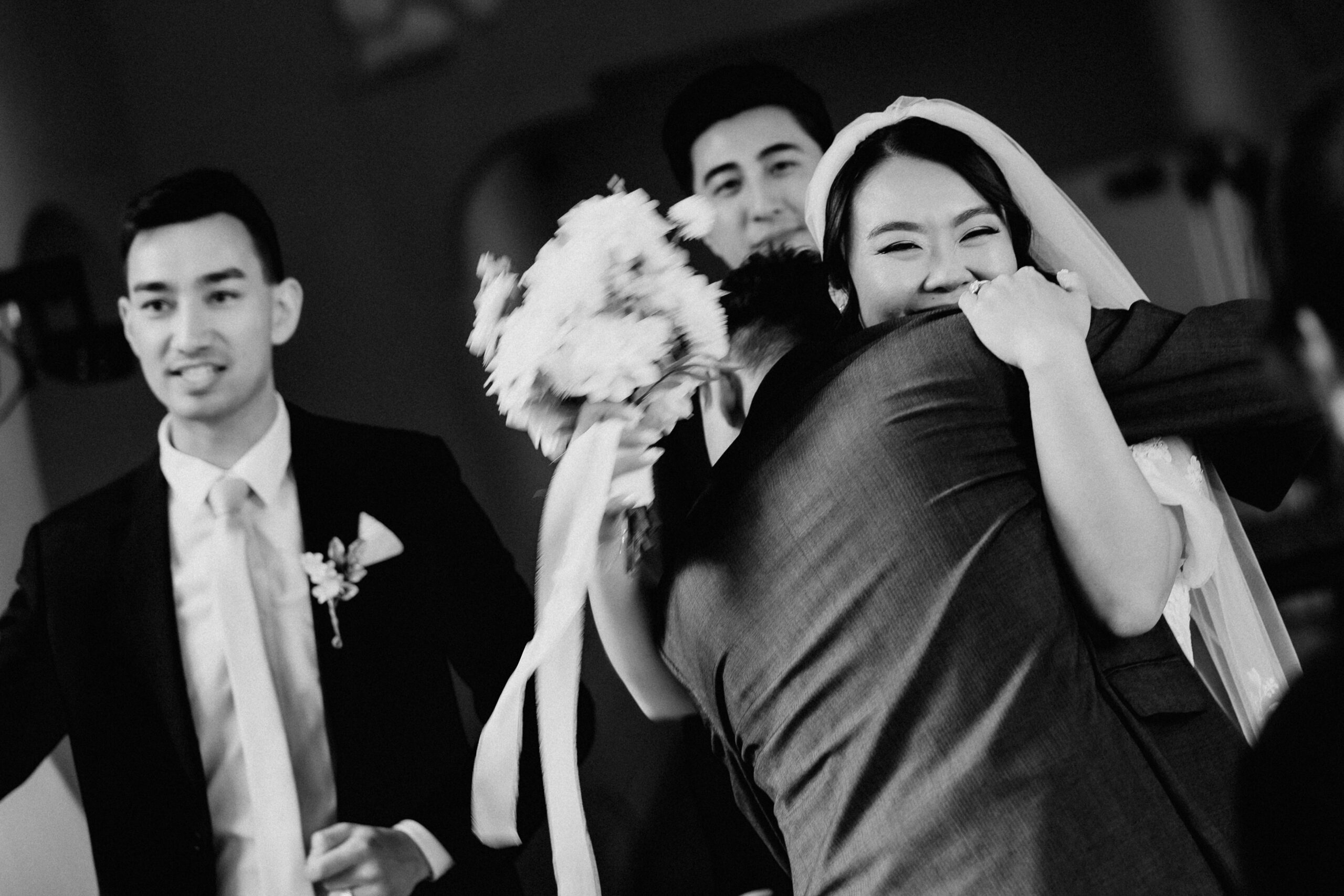 Bride and groom embracing during their Oahu wedding, captured in an editorial documentary style.